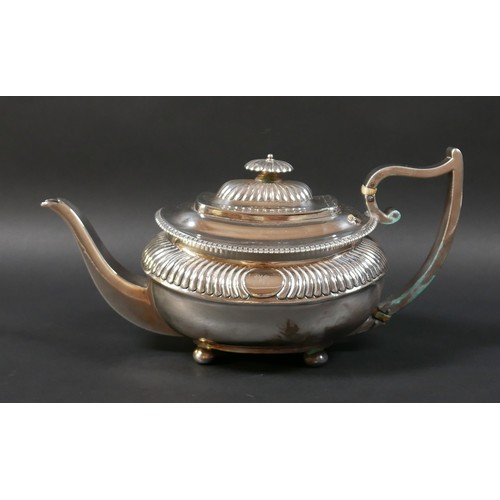 94 - A Regency silver teapot, of compressed urn form with gadrooned decoration, on bun feet, the handle w... 