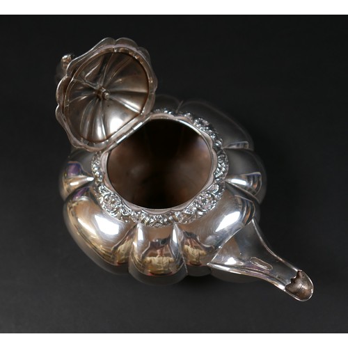 100 - A Regency silver teapot, of lobed melon form with pomegranate finial to the hinged cover, on a circu... 