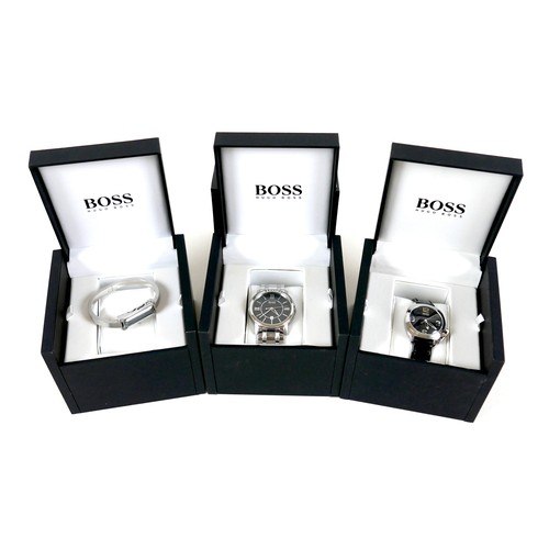 211 - A group of three Hugo Boss stainless steel wristwatches, two gents, cases 40 and 34.5mm, and one lad... 