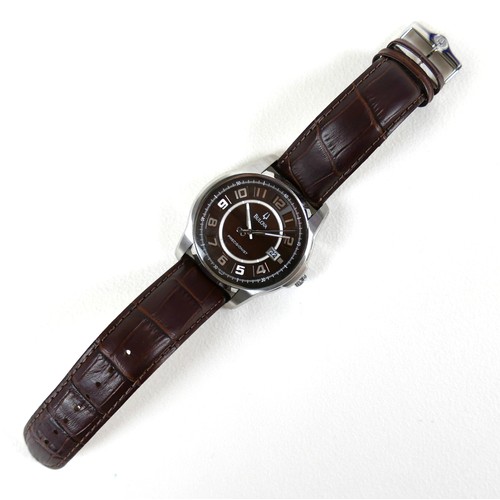 214 - A Bulova Precisionist stainless steel gentleman's wristwatch, in 1950's style, circular mahogany bro... 