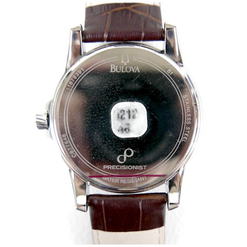 214 - A Bulova Precisionist stainless steel gentleman's wristwatch, in 1950's style, circular mahogany bro... 