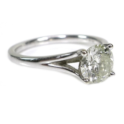 374 - An 18ct white gold and solitaire diamond ring, the round brilliant cut stone, 6.3mm by 3.6mm, 0.87ct... 