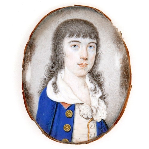 249 - A portrait miniature on ivory depicting a boy in a blue coat with long black hair, possibly 17th cen... 