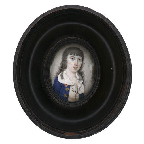 249 - A portrait miniature on ivory depicting a boy in a blue coat with long black hair, possibly 17th cen... 