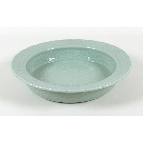 9 - A modern Chinese celadon porcelain bowl, with scalloped rim, decorated with fine incised designs of ... 