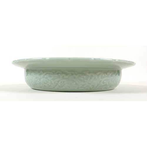 9 - A modern Chinese celadon porcelain bowl, with scalloped rim, decorated with fine incised designs of ... 