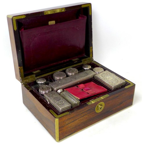 105 - A Victorian coromandel and brass inlaid travel case, with a fitted interior featuring silver mounted... 