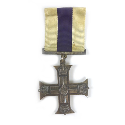 90 - A group of WWI medals, with gallantry award, comprising The Military Cross, King George V GRI cypher... 