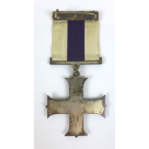 90 - A group of WWI medals, with gallantry award, comprising The Military Cross, King George V GRI cypher... 