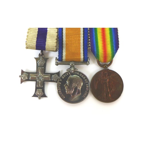 90 - A group of WWI medals, with gallantry award, comprising The Military Cross, King George V GRI cypher... 