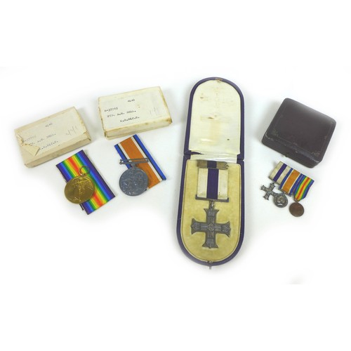 90 - A group of WWI medals, with gallantry award, comprising The Military Cross, King George V GRI cypher... 