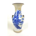 A Chinese porcelain vase, Qing Dynasty, 19th century, of baluster form with twin applied lion dog an... 