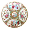 A Canton porcelain dish, late 19th century, typically decorated with four panels, 3.2 by 24.7cm.