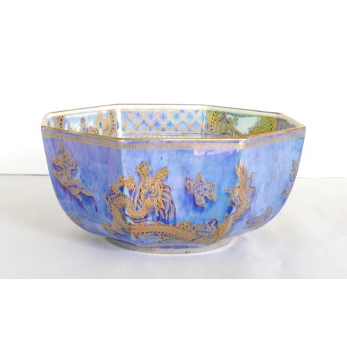 31 - A Wedgwood pottery bowl, octagonal form, lustre glaze with dragons, birds, and buildings, pattern nu... 