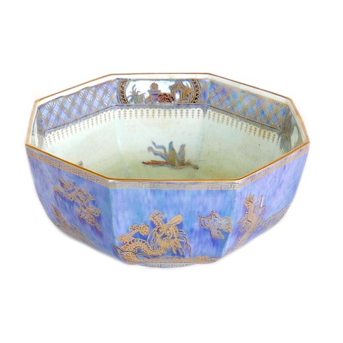 31 - A Wedgwood pottery bowl, octagonal form, lustre glaze with dragons, birds, and buildings, pattern nu... 