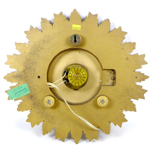 91 - A vintage Smiths Sectric sunburst form wall clock, 33 by 33 by 7 cm.