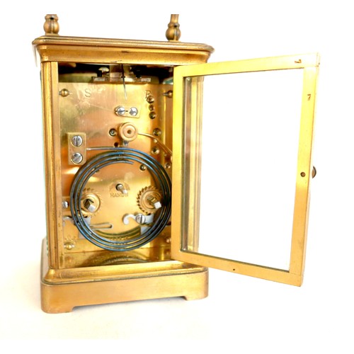 96 - A French 19th century repeating brass carriage clock, retailed by Dent, London, with white enamel di... 