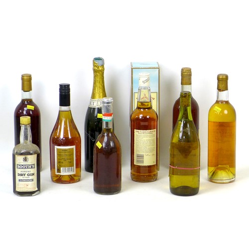 97 - A group of vintage wine and spirits, including a bottle of 1964 Chateau Carbonnieux, Leognan. (9)