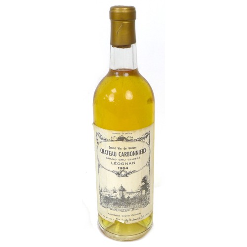 97 - A group of vintage wine and spirits, including a bottle of 1964 Chateau Carbonnieux, Leognan. (9)