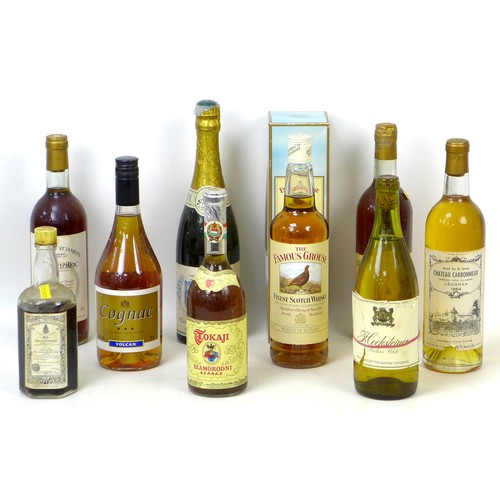 97 - A group of vintage wine and spirits, including a bottle of 1964 Chateau Carbonnieux, Leognan. (9)