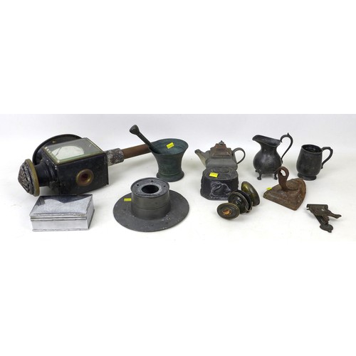 69 - A group of mixed metal items, including a coaching lamp, a small cast iron lidded box, and a bronze ... 