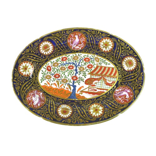 37 - A group of three oval serving dishes, early 19th century, decorated with reserves of a Chinese garde... 