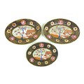 A group of three oval serving dishes, early 19th century, decorated with reserves of a Chinese garde... 