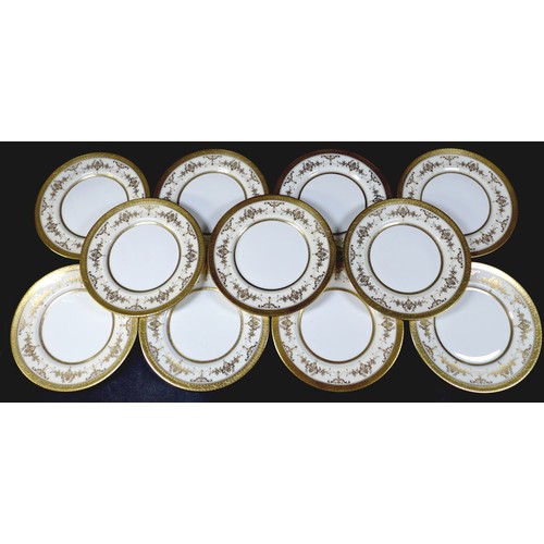 35 - A Minton china part dinner service, decorated in the Riverton pattern, comprising eleven dinner plat... 