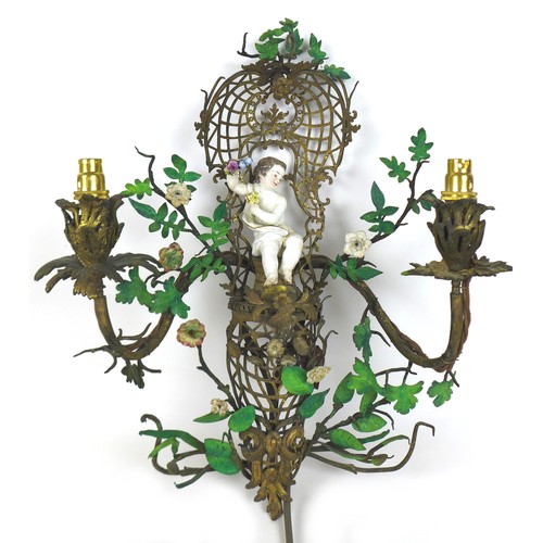 55 - A pair of Rococo style gilt metal, two branch wall lights, modelled with Dresden porcelain cherubs, ... 