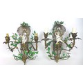 A pair of Rococo style gilt metal, two branch wall lights, modelled with Dresden porcelain cherubs, ... 