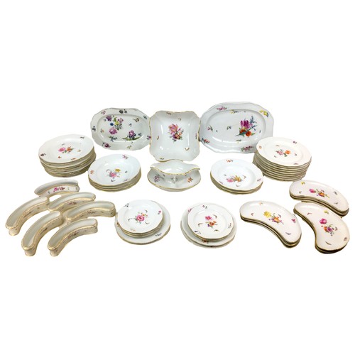 41 - A collection of over fifty pieces of 19th century KPM Berlin porcelain, each piece individually deco... 