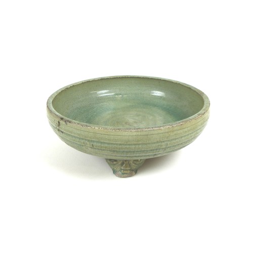 10 - A Chinese 'Longquan' celadon tripod censer, possibly Ming, crackled green glaze running to an uneven... 