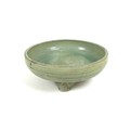 A Chinese 'Longquan' celadon tripod censer, possibly Ming, crackled green glaze running to an uneven... 
