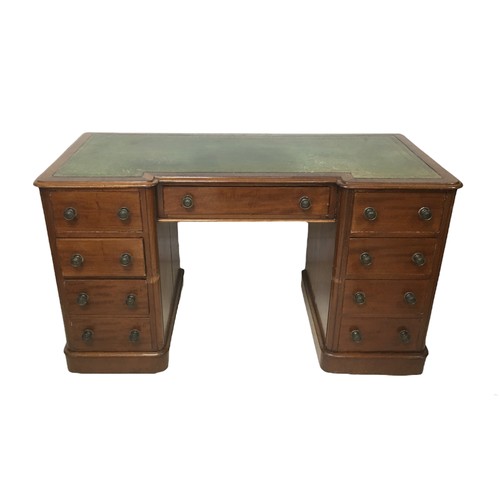 163 - An early 20th century mahogany inverted kneehole desk, with leather inset top, a single drawer flank... 