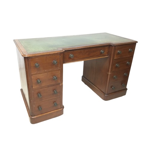 163 - An early 20th century mahogany inverted kneehole desk, with leather inset top, a single drawer flank... 