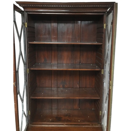 162 - An early 20th century mahogany bookcase, the top section with three shelves, the base section with a... 