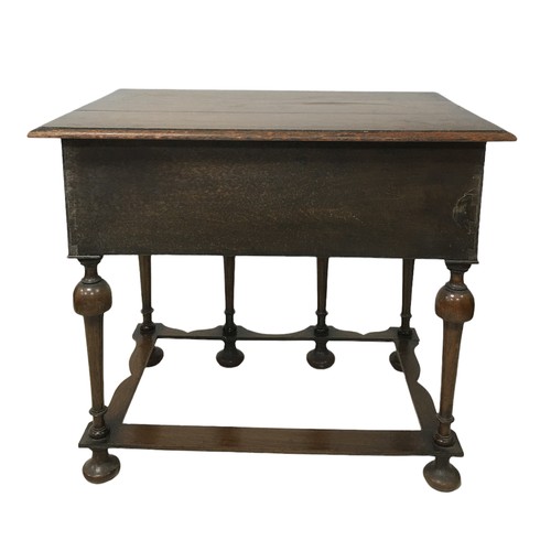 153 - A William and Mary style lowboy, with three drawers, shaped apron raised upon six turned legs with p... 