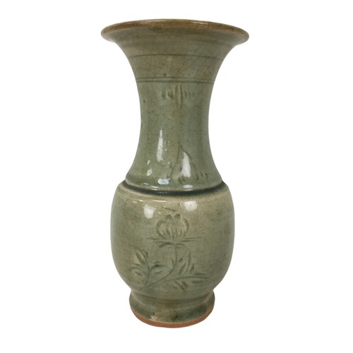 5 - A 19th century Chinese celadon vase, of baluster form with incised decoration under a green crackle ... 