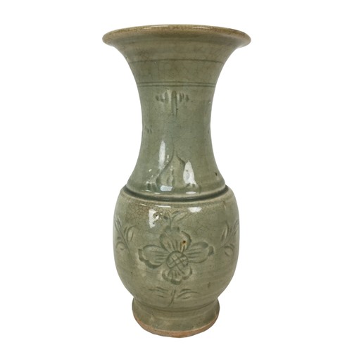 5 - A 19th century Chinese celadon vase, of baluster form with incised decoration under a green crackle ... 