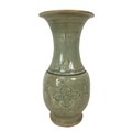 A 19th century Chinese celadon vase, of baluster form with incised decoration under a green crackle ... 
