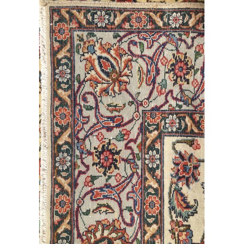 203 - A Tabriz rug, with caucasian ground, central red ground flower design surrounded by profuse floral d... 