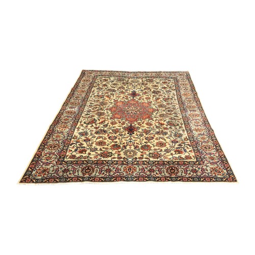 203 - A Tabriz rug, with caucasian ground, central red ground flower design surrounded by profuse floral d... 