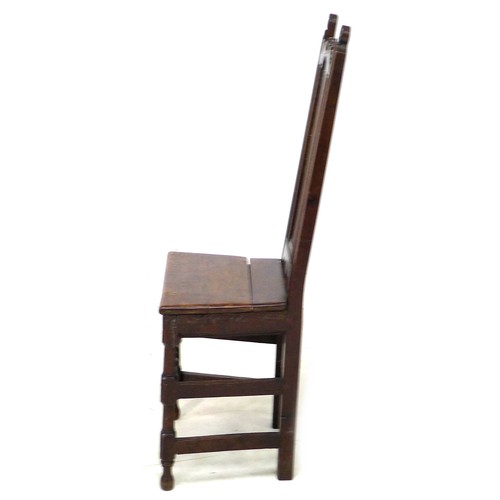 184 - A 17th century oak side chair, with scroll finials and solid seat, raised on turned supports with kn... 