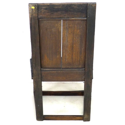 212 - A 17th century oak Wainscot chair, with open scroll end arms, solid seat with octagonal section inse... 