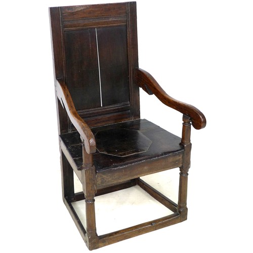 212 - A 17th century oak Wainscot chair, with open scroll end arms, solid seat with octagonal section inse... 