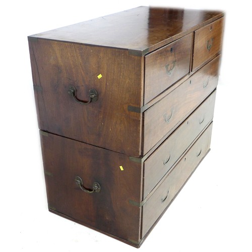 198 - An early Victorian mahogany campaign chest of two short over three long drawers, flush campaign bras... 