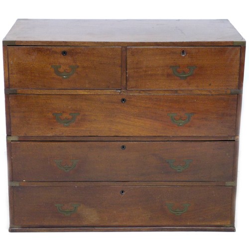 198 - An early Victorian mahogany campaign chest of two short over three long drawers, flush campaign bras... 