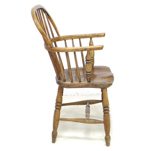 175 - An 18th century elm and oak low back Windsor open arm chair, with H stretcher and turned legs, 52.5 ... 