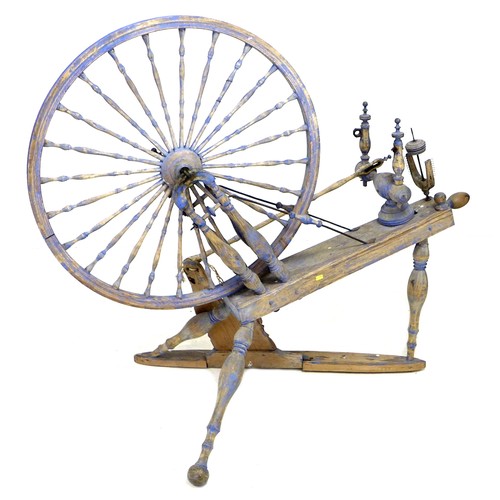 58 - A 19th century spinning wheel, painted blue, a/f, 124 by 66 by 109 cm high.