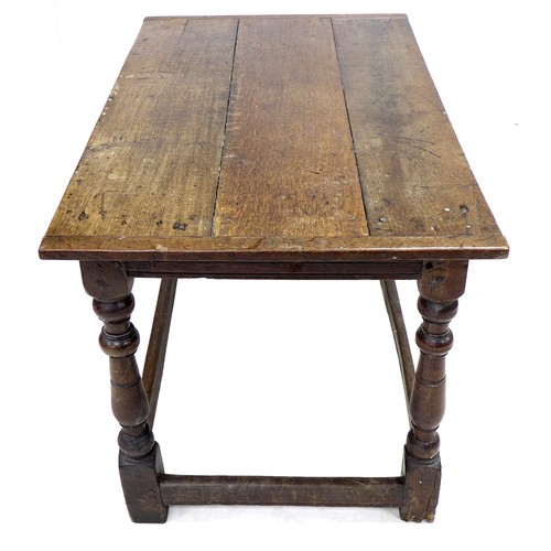 207 - A 17th century oak table, three plank rectangular top with breadboard ends, channelled freeze, raise... 